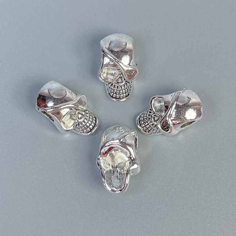 Koralik-wstawka w formie czaszki, kolor metalu srebrny, wymiary 12×19×9 mm, otwór 4 mm, opakowanie 20 g (~5 szt.)