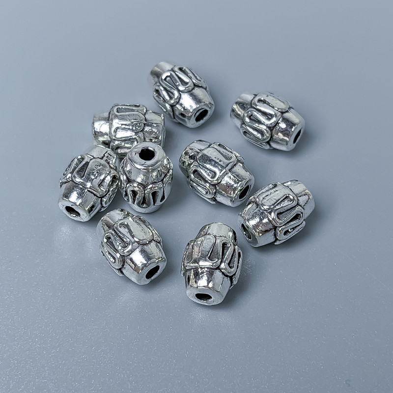 Furnitura – wstawka do koralików, kolor metalu srebrny, średnica 7×9 mm, otwór Ø1,8 mm ±, opakowanie 20 g (~15 szt.)