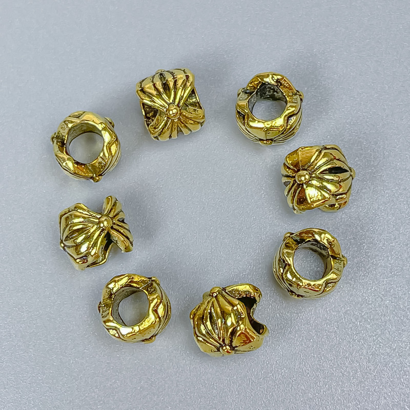 Koralik-wkładka w kolorze złotym, średnica 7×7 mm, otwór około 4 mm, opakowanie 18 szt.