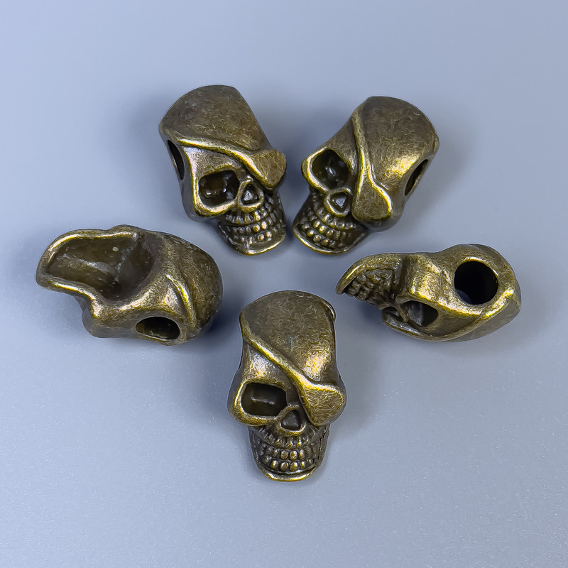 Koralik-wkładka do biżuterii w formie czaszki, kolor metalu: brąz, średnica 12×18×8 mm ± otwór, średnica 4 mm ± opakowanie 20 g (~5 szt.)