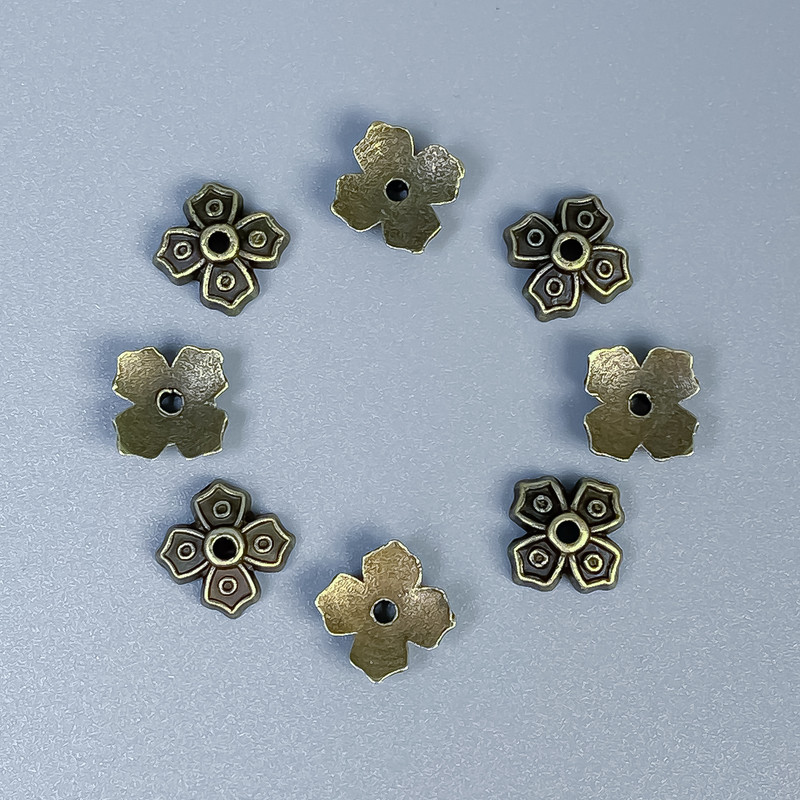 Okucie – czapeczka do koralika, kolor metalu brązowy, średnica 7×1 mm ± otwór 1 mm ± opakowanie 50 szt.