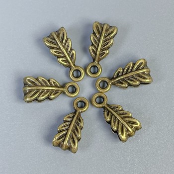 Bajl w kolorze brązu, rozmiar 14×7×5 mm, otwory 2,5 mm i 1,8 mm, opakowanie 22 szt.