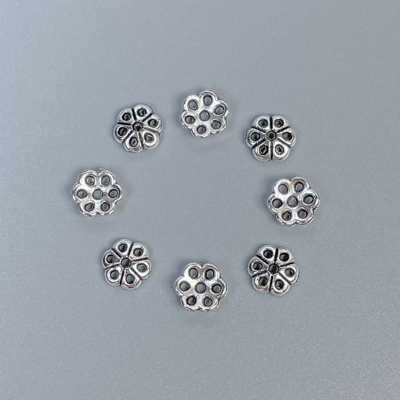Kapselki do koralików w kolorze srebra, średnica 6×1 mm ± otwór 1 mm ± opakowanie 80 szt.