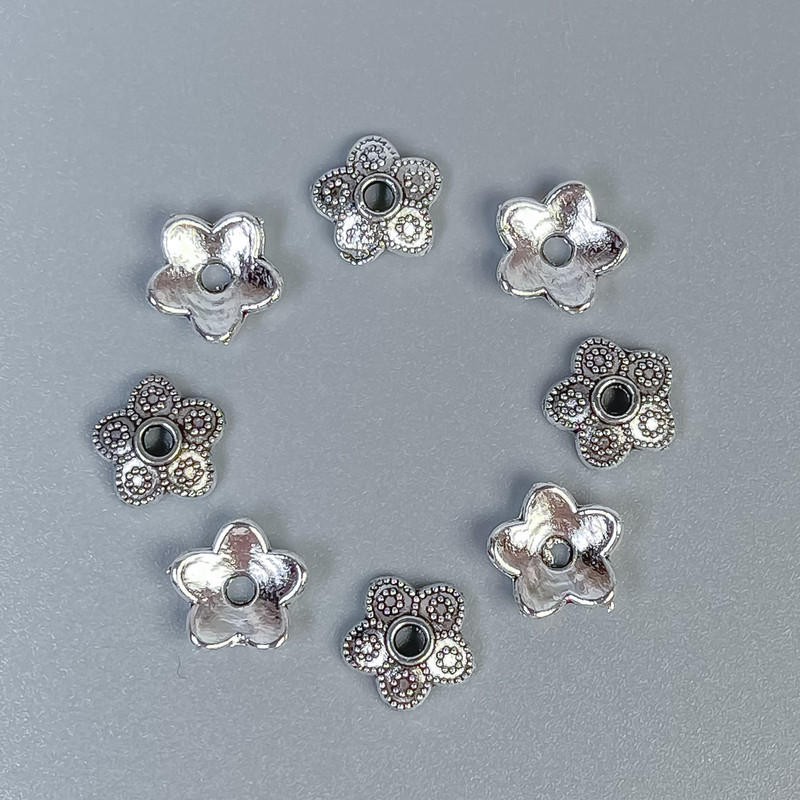 Furnitura kapeluszek do koralików, kolor metalu srebrny, średnica 7 mm ± otwór, średnica 1 mm ± opakowanie 20 g (~90 szt.)