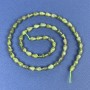 Koraliki z jadeitu w kształcie kropli 7×4 mm, na nici, długość około 39 cm.