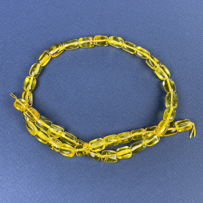 Koraliki bursztynowe fasetowane 10×7 mm ± na nici, długość 39 cm