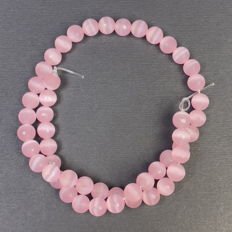 Koraliki «Kocie oko» różowe, syntetyczne kamienie, gładkie kulki, średnica 8 mm ±, otwór 1 mm ±, długość 38 cm ±