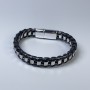 Bransoletka męska z ekoskóry czarna z metalowymi wstawkami, grubość ok. 12 mm, długość ok. 22 cm, srebrzysty metal na zapięciu
