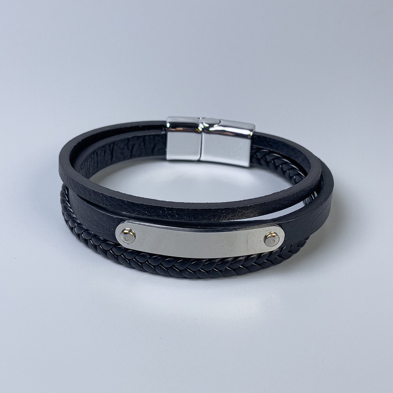 Bransoleta męska z ekoskóry czarna z metalowymi wstawkami, grubość 10–19 mm ±, długość 22 cm ±, srebrny metal na zapięciu