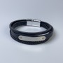 Bransoleta męska z ekoskóry czarna z metalowymi wstawkami, grubość 10–19 mm ±, długość 22 cm ±, srebrny metal na zapięciu