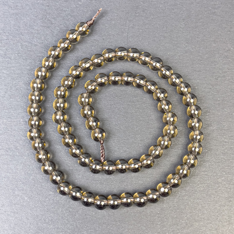 Koraliki topazu dymnego – gładka kulka 6 mm ±, na nitce, długość 39 cm ±
