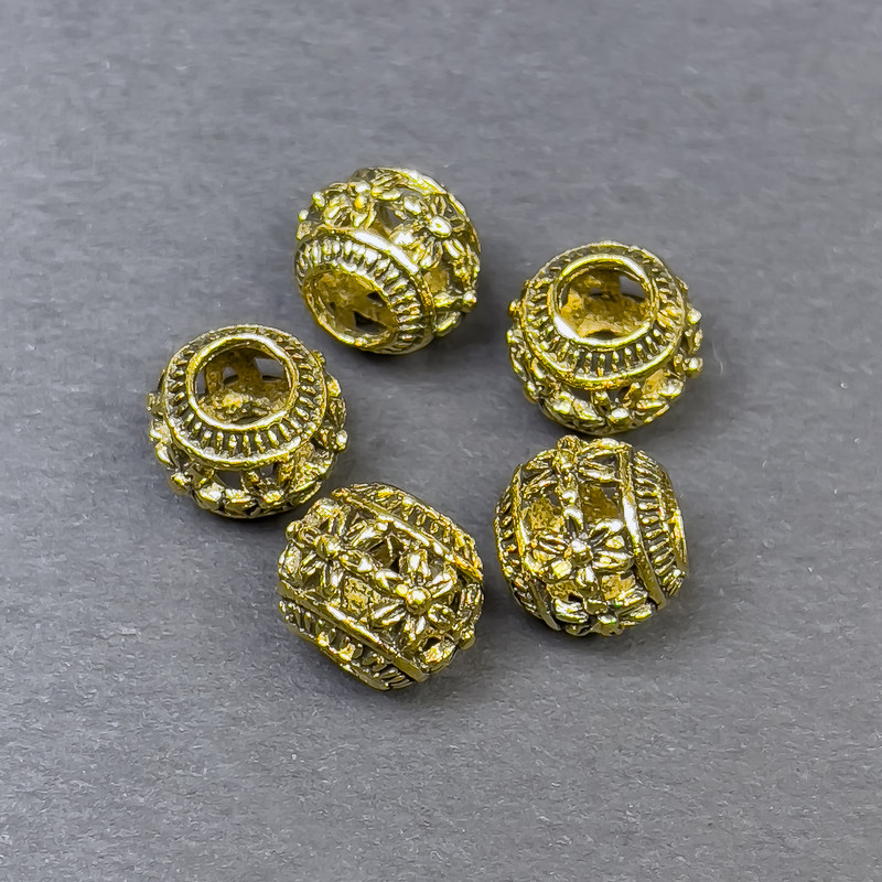 Koralik-wstawka o złocistym kolorze metalu, średnica 9×10 mm, otwór 5 mm, opakowanie 5 szt.