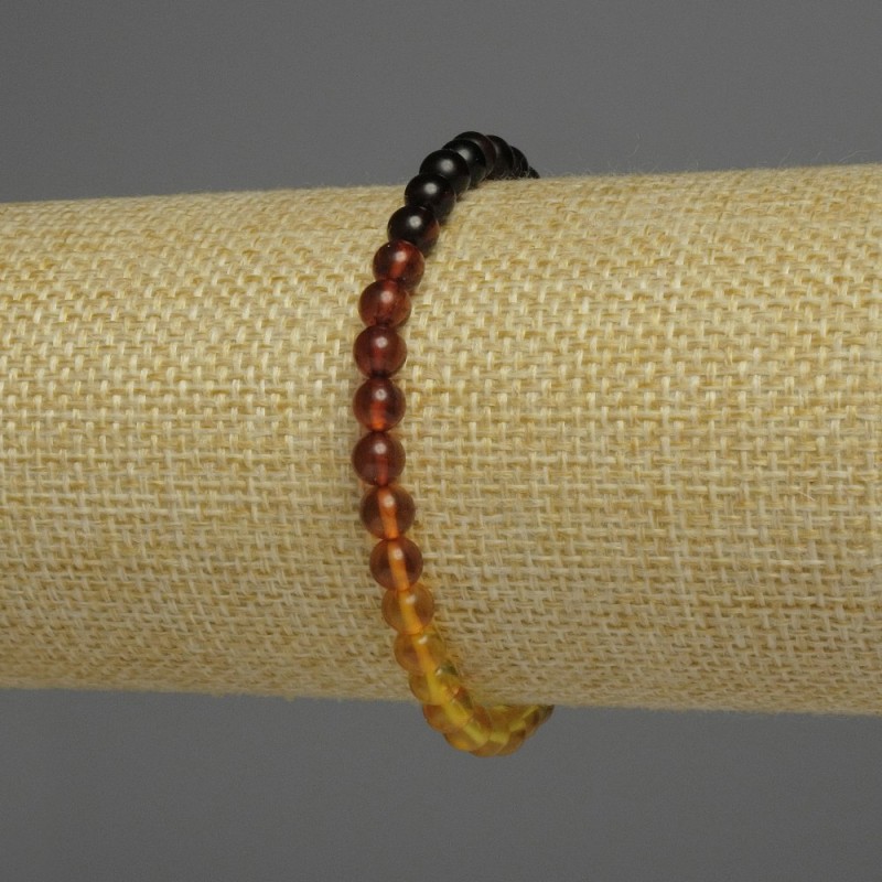 Bransoletka z bursztynu gradient – gładkie kuleczki, średnica 5 mm, długość 18 cm, elastyczna