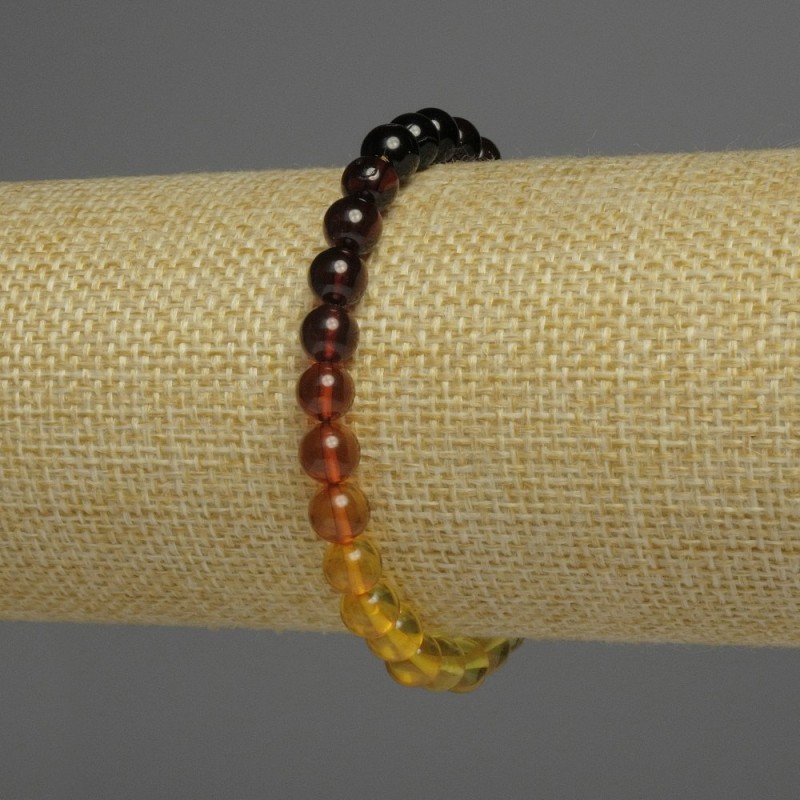 Bransoletka bursztynowa gradientowa, gładkie kuleczki, średnica 6 mm, długość 18 cm, elastyczna