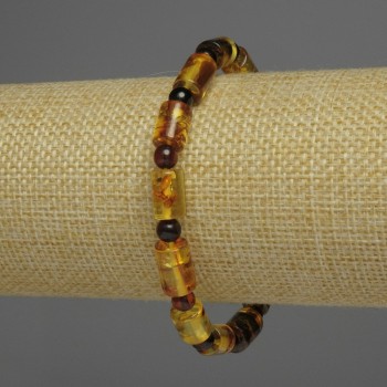 Bransoletka z bursztynu o cylindrycznych koralikach, średnica ok. 7×10 mm, kuleczki o średnicy 5 mm, długość 18 cm, elastyczna