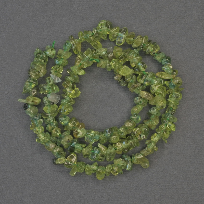Kryszolitowe koraliki, drobne, średnica 5×3 mm, na nitce, długość ok. 40 cm