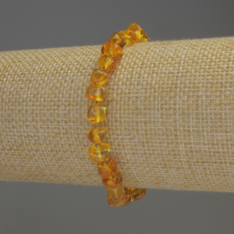 Bransoletka z bursztynu fasetowanego 7×5 mm, koraliki 2 mm, długość 18 cm, na elastycznej gumce