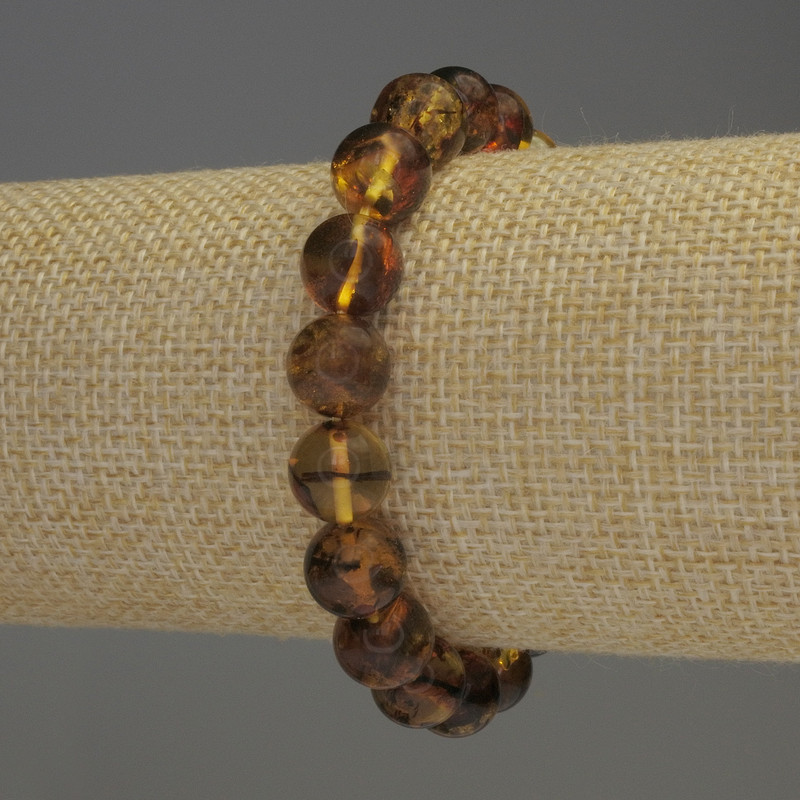 Bransoletka bursztynowa z gładkimi kuleczkami, średnica 9,5 mm, długość 18 cm, elastyczna