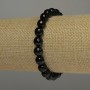 Bransoletka z agatu fasetowanego, kulka o średnicy 8 mm, długość 18 cm, na gumce elastycznej.