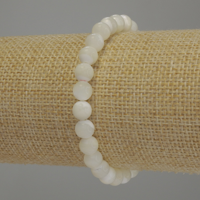 Bransoletka z masy perłowej, gładkie kuleczki o średnicy 7 mm, długość 18 cm, na elastycznej gumce