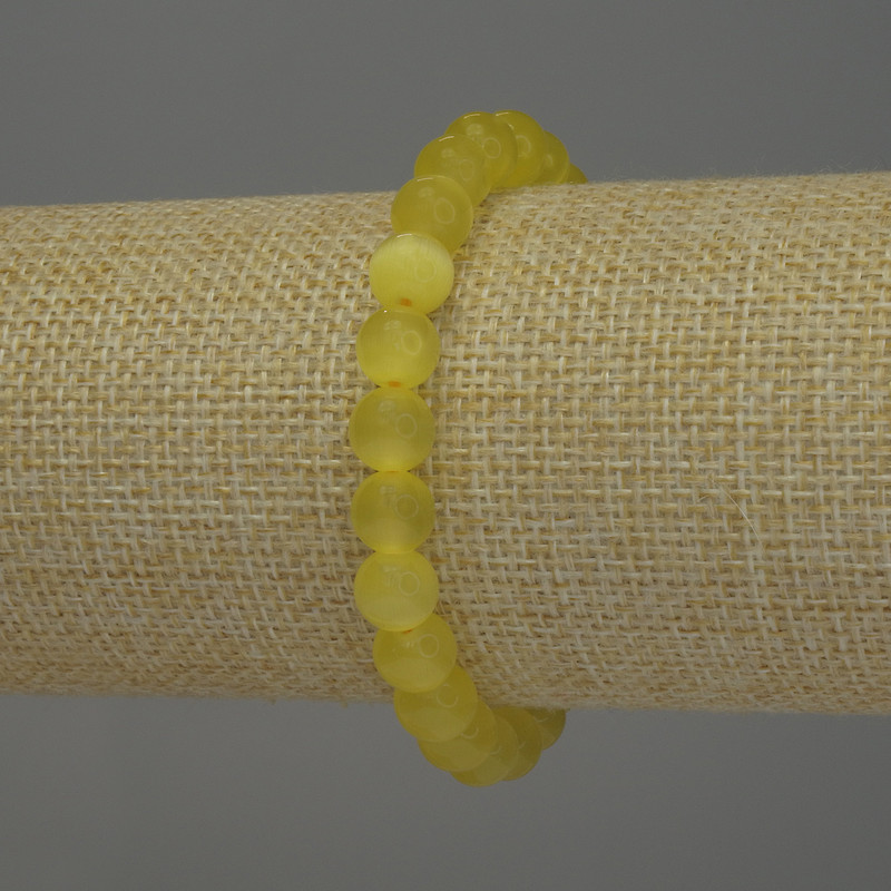 Bransoletka z żółtym kocim okiem, gładkie kulki, średnica około 8 mm, długość około 18 cm, na elastycznej gumce