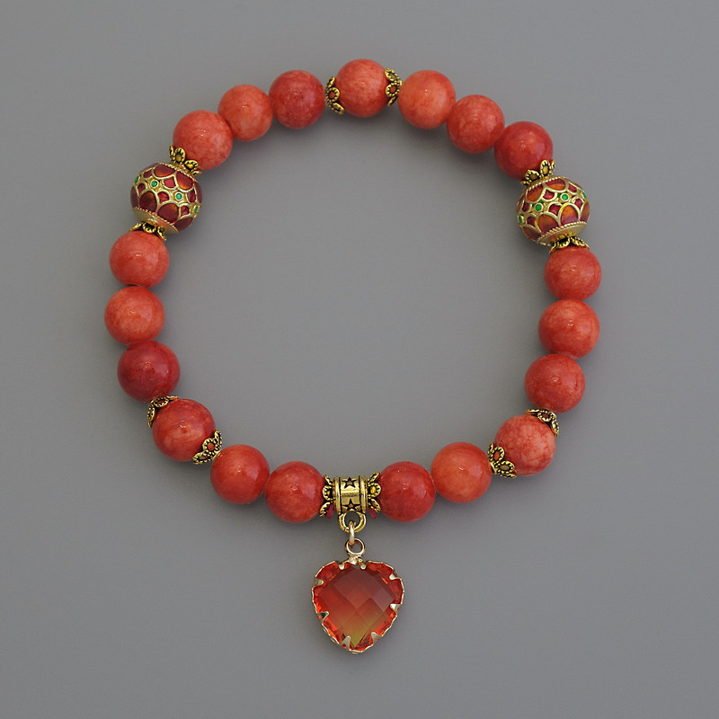 Bransoletka z pomarańczowego koralu (sztuczny) z gładkimi kulkami o średnicy 8 mm, emalia cloisonné o średnicy około 10 mm, z metalowymi wstawkami, długość 18 cm, elastyczna