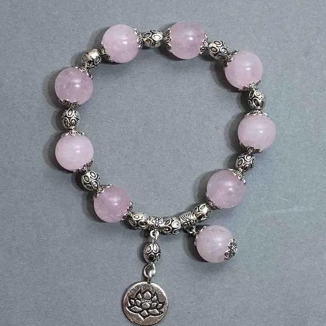 Bransoletka z różowego kwarcu w kuleczkach, średnica 12 mm, z metalowymi wstawkami, długość 18 cm, na elastycznej gumce
