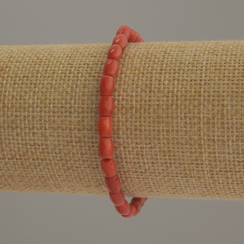 Bransoletka z sztucznego koralu w formie koralika barilowego, średnica 6×4 mm, 5 mm +/-, długość 18 cm, na gumce elastycznej