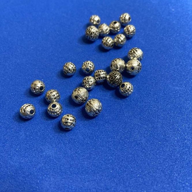 Koralik-wkładka, średnica 7 mm, średnica wewnętrzna 2 mm, opakowanie 20 szt. (+/-)