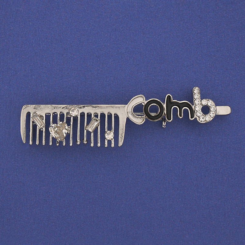 Broszka „Grzebień” z białymi kryształami, metal srebrzysty 60×12 mm+