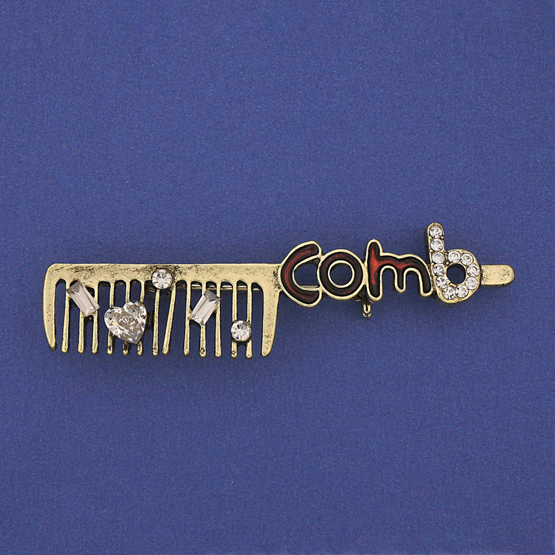 Broszka Grzebień z białymi kryształami, metal złocisty, 60×12 mm+