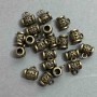 Bajl w kolorze brązu, wymiary 9x7x10 mm ± otwory, średnica 4 mm ±, średnica 2–3 mm ±, opakowanie 20 g (~21 szt.)