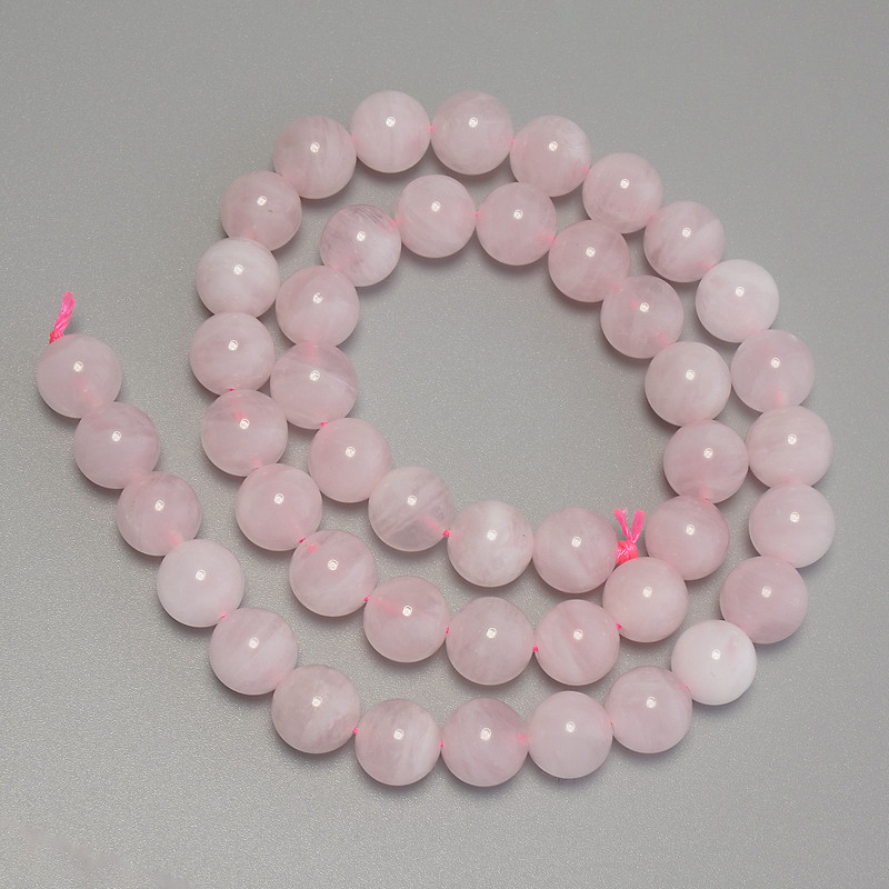 Koraliki z madagaskarskiego różowego kwarcu — gładka kula, średnica 8,5 mm, długość 39 cm