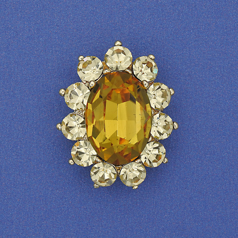 Broszka 'Akcent' z żółtym kryształem, strass, metal złocisty 30×24 mm+