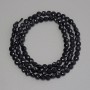 Koraliki z czarnego turmalinu, fasetowane monetki, średnica 4 mm, długość 39 cm, na nici