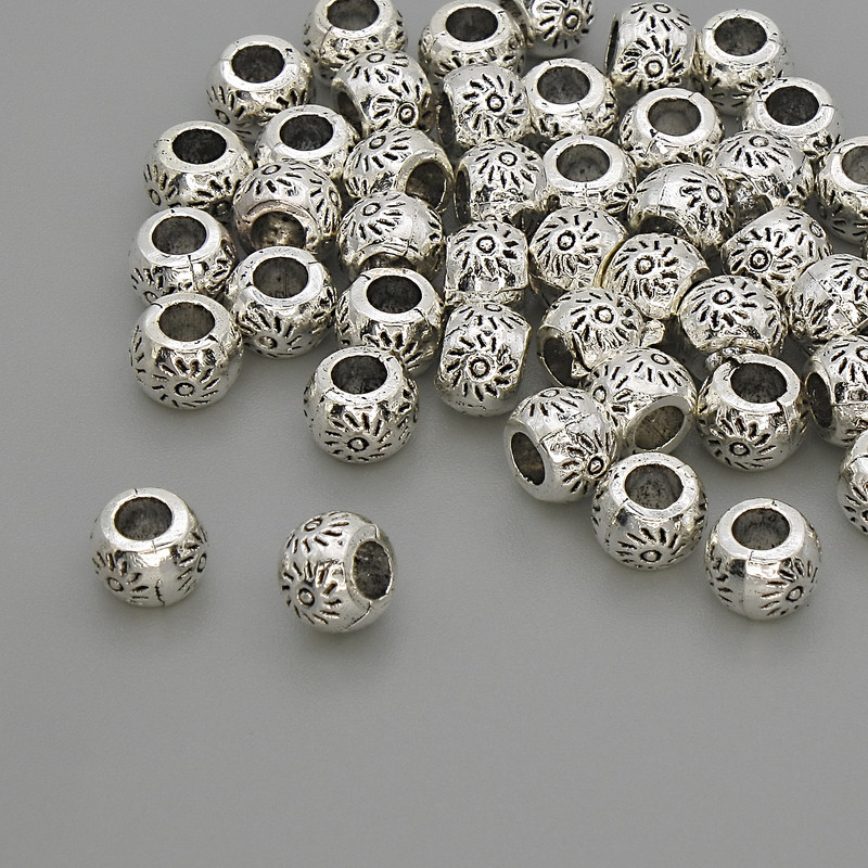 Koralik-wkładka w kolorze metalu – srebro, średnica 6×4 mm, otwór ok. 3 mm, opakowanie 20 g (~45 szt.)