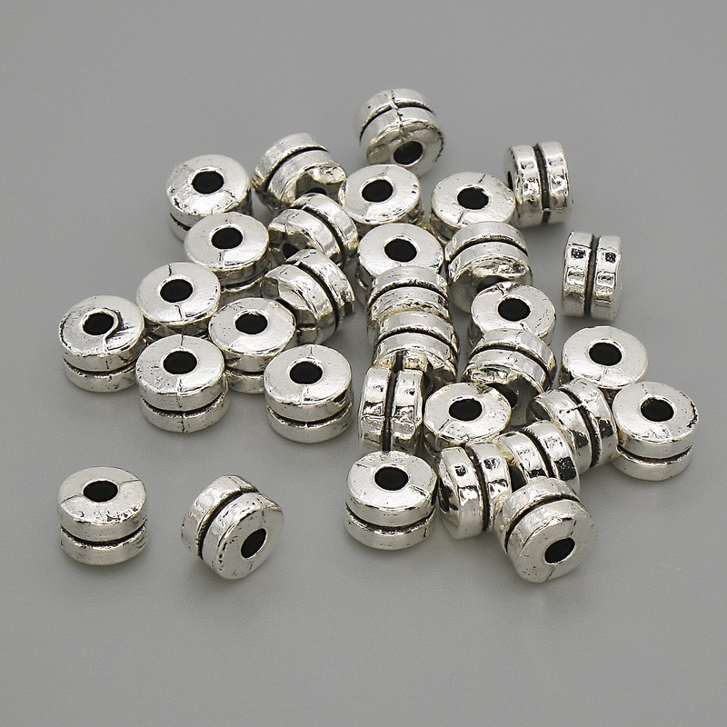 Koralik-wstawka, kolor metalu: srebrny, wymiary 6×4 mm, otwór 2,2 mm, opakowanie 20 g (~30 szt.)
