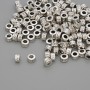 Furnitura: koralik-wstawka, kolor metalu: srebro, średnica 4×2,5 mm, otwór 2 mm, opakowanie 20 g (~128 szt.)
