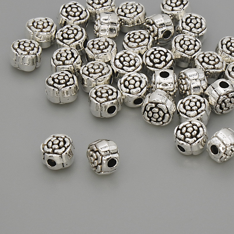 Koralik-wstawka o kolorze metalu srebrnym, średnica 6×5 mm, otwór około 1,8 mm, opakowanie 20 g (~32 szt.)