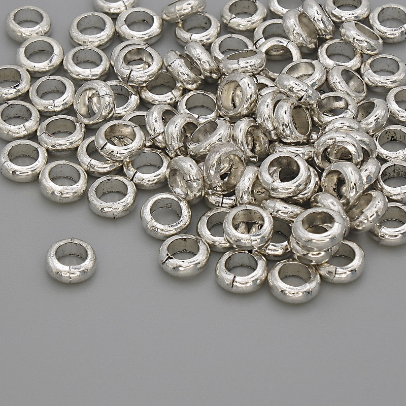 Koralik-wstawka Koniczyna, kolor srebrny, średnica 6×2 mm, otwór około 3,8 mm, opakowanie 20 g (~92 szt.)