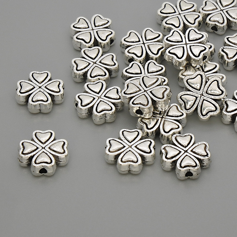 Koralik-wkładka w kształcie koniczyny, kolor metalu: srebrny, wymiary 9,5×9,5×3 mm, otwór 1,5 mm, opakowanie 20 g (~19 szt.)