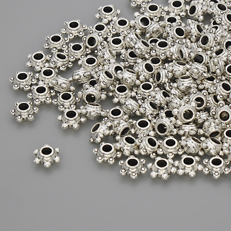 Okucia do biżuterii – koralik-wstawka, kolor metalu srebro, średnica 5×2,5 mm, otwór około 2,8 mm, opakowanie 20 g (~130 szt.)
