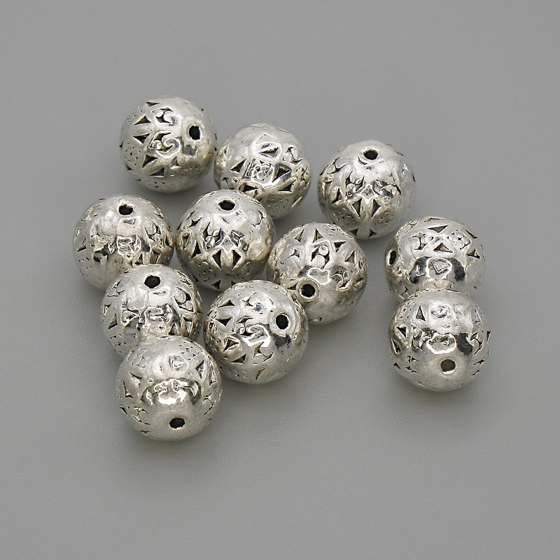 Koralik-wkładka o kolorze srebrzystym, średnica 8 mm, otwór ok. 1,2 mm, opakowanie 20 g (~11 szt.)