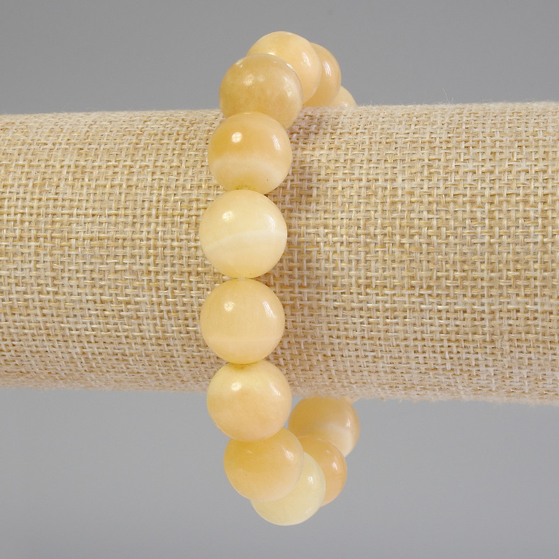 Bransoletka z żółtego agatu, gładkie kulki o średnicy około 14 mm, długość około 18 cm, elastyczna