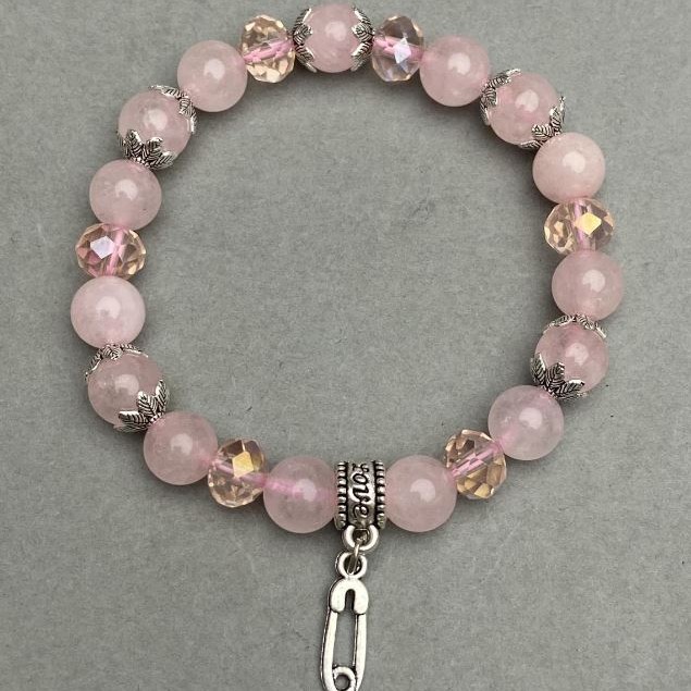 Bransoletka z różowego kwarcu w kuleczkach, średnica ok. 8 mm, czeskie kryształy w formie rondeli 8×6 mm, z metalowymi wstawkami, długość ok. 18 cm, stretch