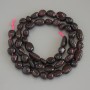 Koraliki granatu fasetowane, na nitce, średnica 8–12×6–8 mm, długość 40 cm+