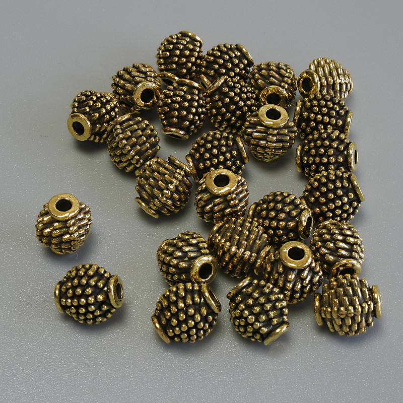 Okucia – koralik-wstawka w kolorze metalu złoto, średnica 7×6 mm ± otwór, średnica 1,9 mm ± opakowanie 20 g (~31 szt.)