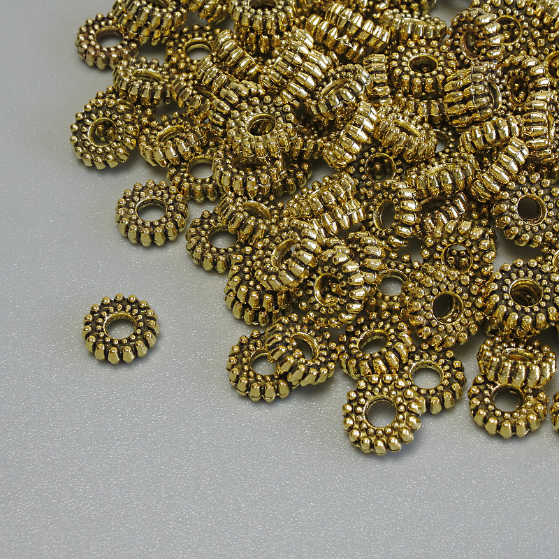Furnitura - wkładka do koralików w kolorze złota, rozmiar 6×2 mm, średnica otworu 2 mm, opakowanie 20 g (~109 szt.)
