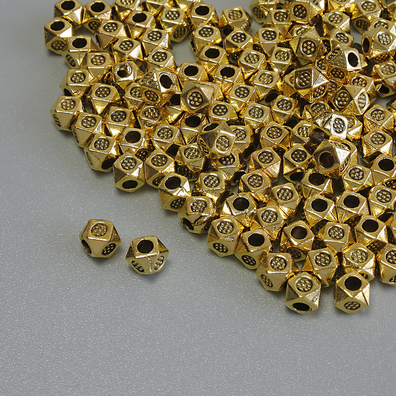 Koralik-wstawka o kolorze złotego metalu, średnica 3×3 mm ±, średnica otworu około 1,7 mm ±, opakowanie 20 g (~128 szt.)