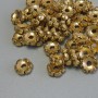 Koralik-wkładka, kolor metalu złoto, średnica 7×3 mm, otwór około 1,9 mm, opakowanie 20 g (~44 szt.)